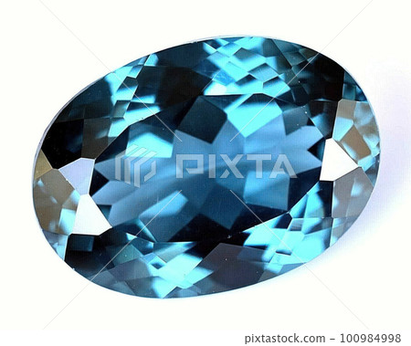 Natural gemstone blue spinel on a gray background 100984998
