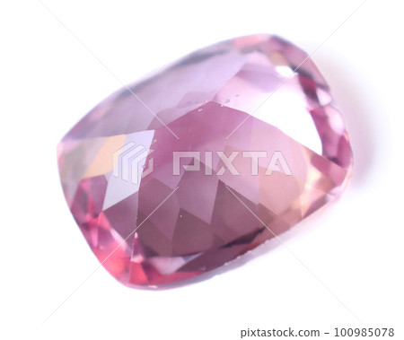 Natural gemstone pink sapphire on gray background Natural gemstone pink sapphire on gray background 100985078