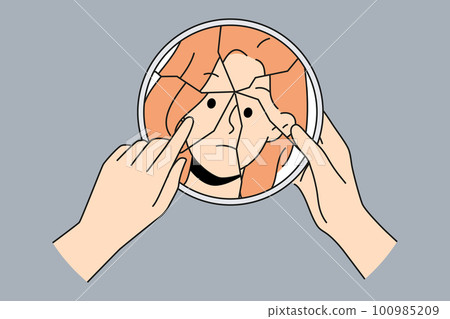 Woman look in mirror suffer from bipolar disorder  100985209