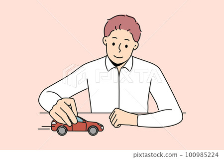Businessman play with car in office  100985224