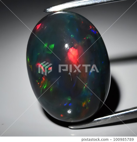 Natural precious stone noble opal on a black background Natural precious stone noble opal on a black background 100985789