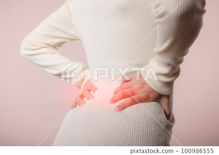 Young woman have waist pain, back ache, lumbar muscle injury problem. Office syndrome disease sick. Healthcare world health day concept. Young woman have waist pain, back ache, lumbar muscle injury problem. Office syndrome disease sick. Healthcare world health day concept. 100986555