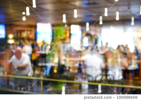 Blur coffee shop or cafe restaurant with abstract bokeh light image background. 100986606