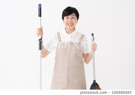 A woman with a mop and a broom on a white background 100986985
