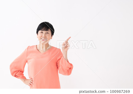 Pointing woman white background 100987269