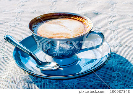 Milk tea or latte coffee with milk in blue vintage cup 100987548