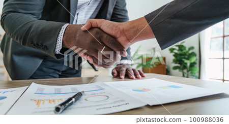 Business Partnerships Handshake at Meeting room. corporate collaboration successful. handshaking after good deal 100988036