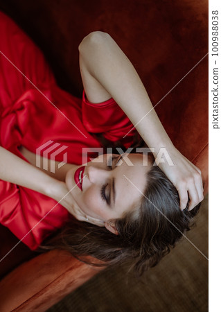 Top view of young woman with evening make-up. Top view of young woman with evening make-up. 100988038