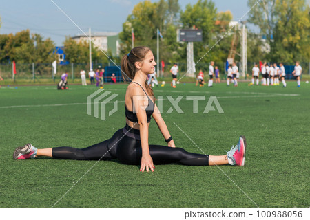 Young woman athlete runnner is exercising Young woman athlete runnner is exercising 100988056