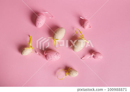 Flat lay with beige and pink pastel Easter eggs on isolated pink background with copy advertising space. Still life. Easter celebration concept. Copy ad space. Christianity. Religious holiday concept 100988871