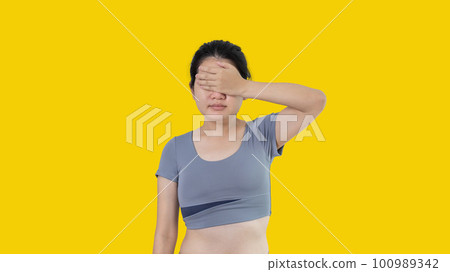 Young woman covering her face and eyes with her hands isolated, Cover your eyes with your hands for fear or prying eyes, Sneak peek, White background. Young woman covering her face and eyes with her hands isolated, Cover your eyes with your hands for fear or prying eyes, Sneak peek, White background. 100989342