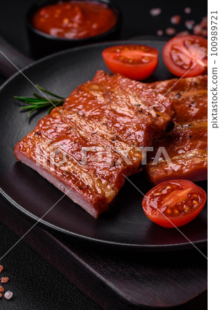 Delicious fresh grilled or smoked ribs with salt, spices and herbs Delicious fresh grilled or smoked ribs with salt, spices and herbs 100989721