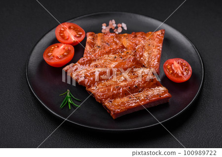Delicious fresh grilled or smoked ribs with salt, spices and herbs 100989722