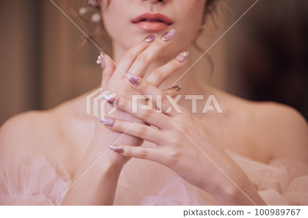 Woman's hand with bridal nails Woman's hand with bridal nails 100989767