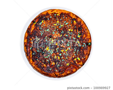 Round dough pie decorated with colored pastry sprinkles. 100989927