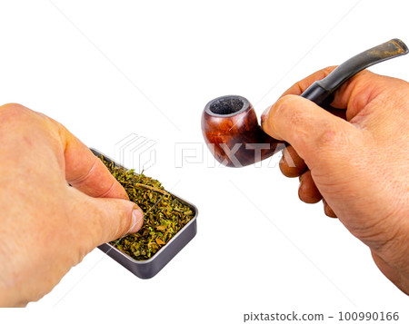 Pipe for smoking tobacco in the hand of a smoker on a white background. Pipe for smoking tobacco in the hand of a smoker on a white background. 100990166