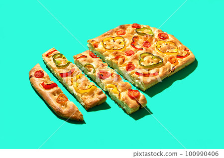 Focaccia primavera minimalist on a green background Focaccia primavera minimalist on a green background 100990406
