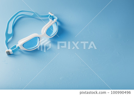 White swimming glasses with a blue lens 100990496