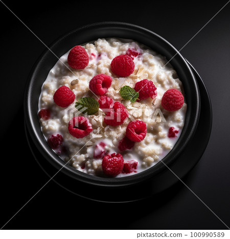 Appetizing delicious oatmeal with raspberries and cream isolated on black close-up, healthy breakfast dish, healthy food,  100990589