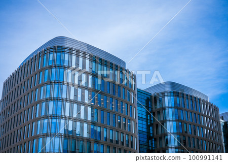 Glass facades of buildings against the sky 100991141