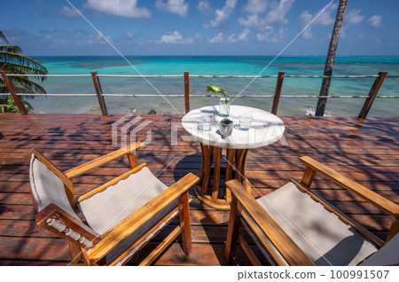 Breakfast on wooden deck 100991507