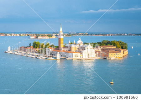 Aerial view of Saint George Island, Italian: Isola San Giorgio, with Campanile San Giorgio in Venetian Lagoon, Venice, Veneto Region, Italy. Photography on sunny summer day Aerial view of Saint George Island, Italian: Isola San Giorgio, with Campanile San Giorgio in Venetian Lagoon, Venice, Veneto Region, Italy. Photography on sunny summer day 100991660