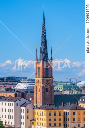 Pointed church tower on the island of Riddarholmen. Part of the former medieval abbey in Stockholm, Sweden. Burial site of most Swedish kings from the 17th century until 1950 Pointed church tower on the island of Riddarholmen. Part of the former medieval abbey in Stockholm, Sweden. Burial site of most Swedish kings from the 17th century until 1950 100991693