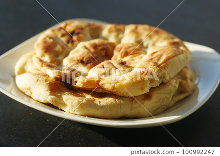 naan bread on a plate naan bread on a plate 100992247
