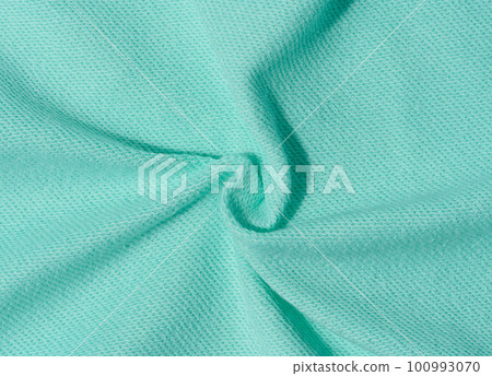 Cotton mint-colored fabric texture for making clothes Cotton mint-colored fabric texture for making clothes 100993070