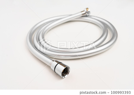 New flexible rubber shower hose on a white background. New flexible rubber shower hose on a white background. 100993393