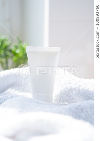 White cream tube and towel in real room interior mock-up, beauty and care product packaging template White cream tube and towel in real room interior mock-up, beauty and care product packaging template 100993760