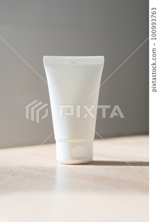 White cream tube on wooden table mock-up, beauty and care product packaging template White cream tube on wooden table mock-up, beauty and care product packaging template 100993763