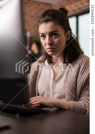 Company coder writing javascript code on computer, sitting at desk parsing algorithm in it programming agency. Software developer working on app developing program. network technology concept Company coder writing javascript code on computer, sitting at desk parsing algorithm in it programming agency. Software developer working on app developing program. network technology concept 100994591