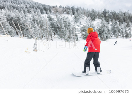 Kids enjoying snowboarding Kids enjoying snowboarding 100997675