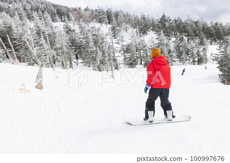 Kids enjoying snowboarding Kids enjoying snowboarding 100997676