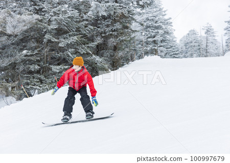 Kids enjoying snowboarding Kids enjoying snowboarding 100997679