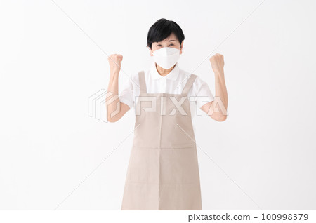 A woman in an apron with a guts pose 100998379