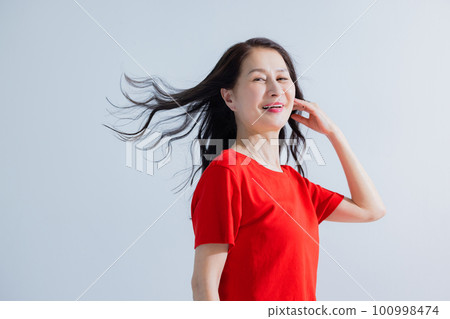 Senior woman hair care image Senior woman hair care image 100998474