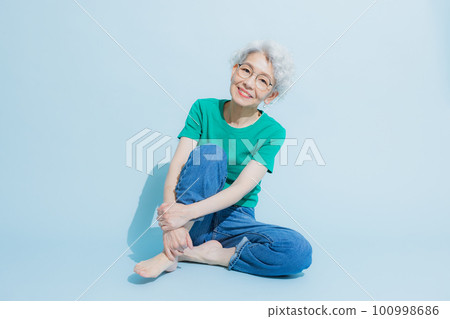 Senior woman in green t-shirt Senior woman in green t-shirt 100998686