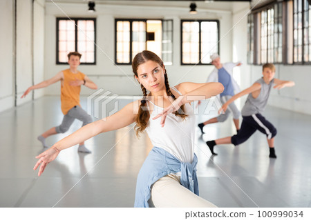 Girl training hip hop at group class 100999034