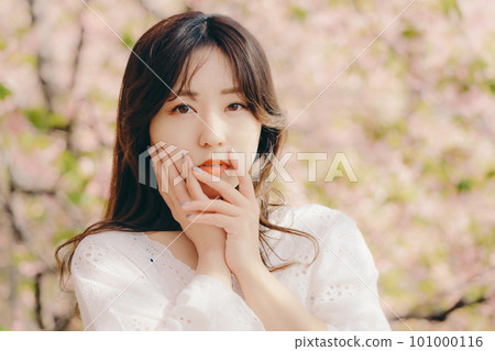 A woman posing under the cherry tree A woman posing under the cherry tree 101000116