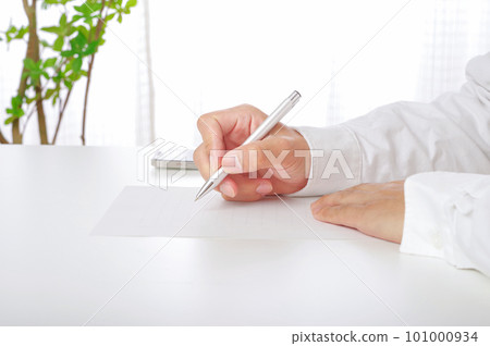 Hand of a man who writes documents 101000934