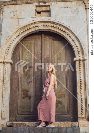 Woman tourist in Old town Kaleici in Antalya. Turkiye. Panoramic view of Antalya Old Town port, Taurus mountains and Mediterrranean Sea, Turkey 101001446