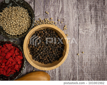 The pepper corn and goji berry on wood table for food concept 101001982