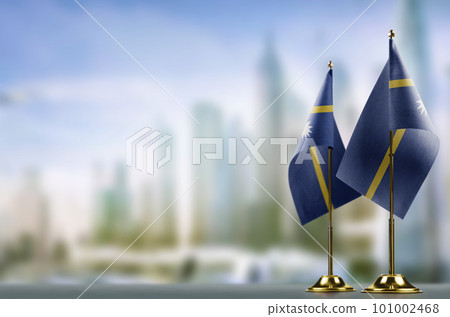 Small flags of the Nauru on an abstract blurry background Small flags of the Nauru on an abstract blurry background 101002468