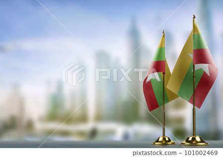 Small flags of the Myanmar on an abstract blurry background 101002469