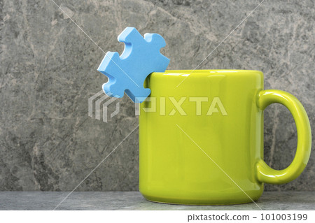 Green cup of coffee and blue puzzle piece Green cup of coffee and blue puzzle piece 101003199
