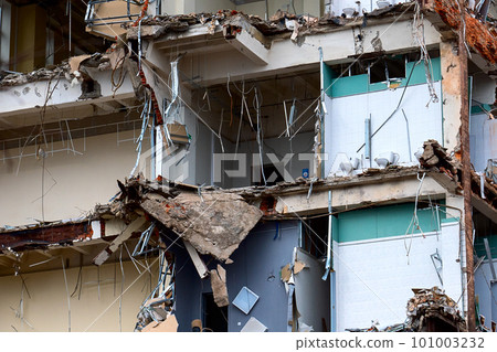 dismantled old building. Half demolished house, dismantling of the old one for the construction of a new building dismantled old building. Half demolished house, dismantling of the old one for the construction of a new building 101003232