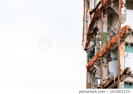dismantled old building. Half demolished house, dismantling of the old one for the construction of a new building dismantled old building. Half demolished house, dismantling of the old one for the construction of a new building 101003233
