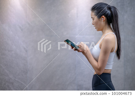 a young woman in sportswear a young woman in sportswear 101004673